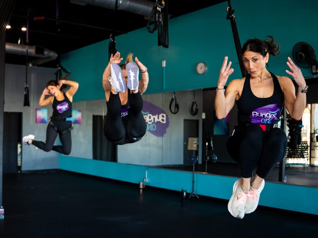 A BungeeONE Studios bungee fitness class in the air, photographed by TMC Marketing