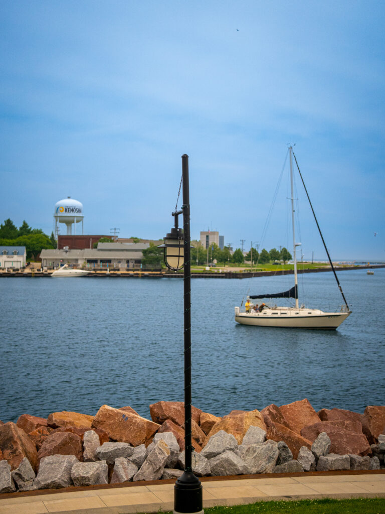 Kenosha water tower overlooking Lake Michigan with a passing boat