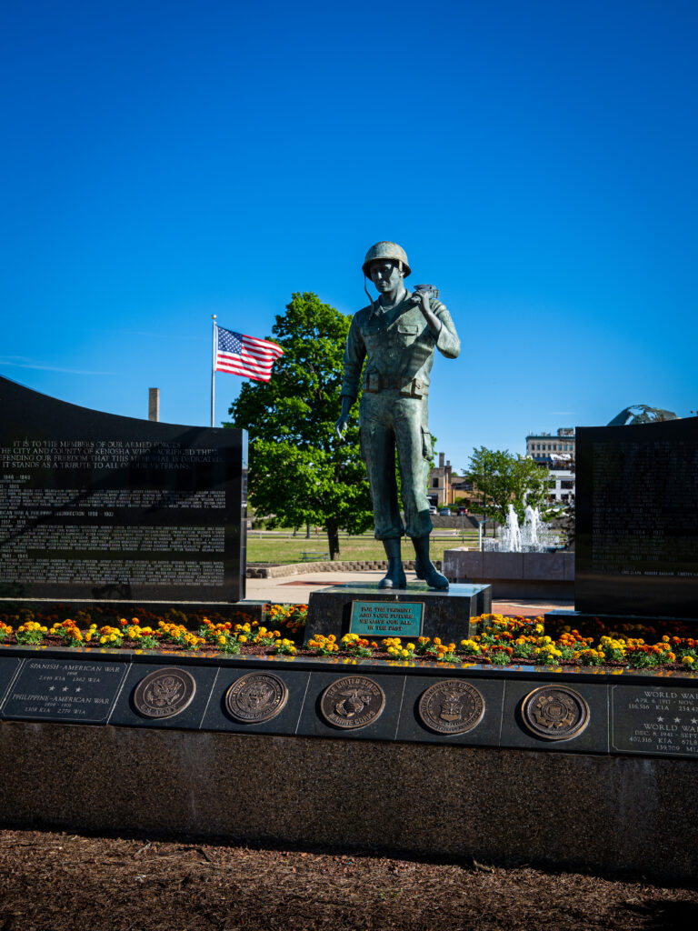Veterans memorial statue and flower beds in downtown Kenosha, photographed by TMC Marketing