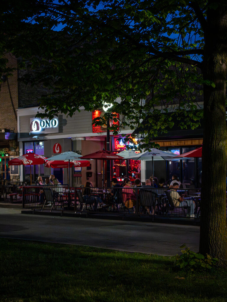 Evening outdoor dining along a downtown Kenosha street, photographed by TMC Marketing