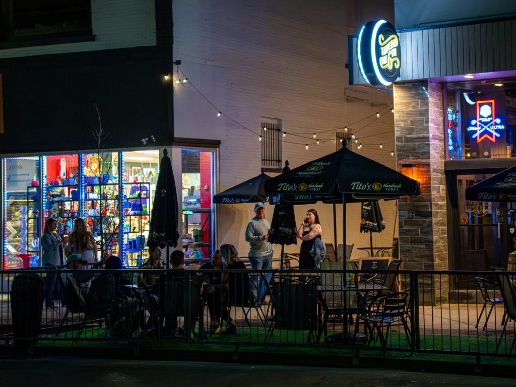 Patio crowd outside a downtown Kenosha bar at night, photographed by TMC Marketing